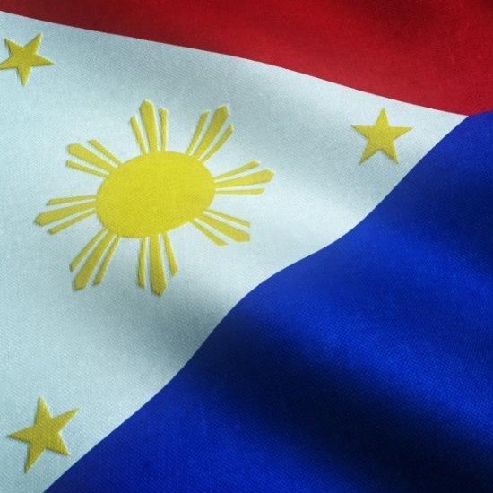 A close-up shot of the Philippine flag with visible fabric textures, representing national identity in a program sequence for events in Quezon City.