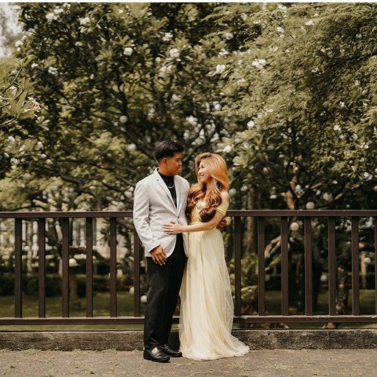 A person reviewing a wedding supplier checklist for catering, styling, and photography at Light of Love Events Place in Quezon City.